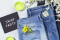 Jeans with flowers and blackboard with inscription Swap Party