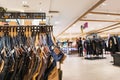 Jeans hanging on the floor in the department store to sell in many sizes in Central Department Store