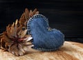 Jeans heart on wooden background