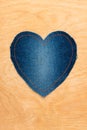 Jeans heart on wooden background Royalty Free Stock Photo