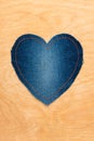 Jeans heart on wooden background