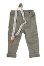 Jeans isolated. Trendy stylish khaki denim pant or trousers for child boy with striped suspenders isolated on a white background.