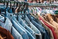 Jeans jackets and retro shirts on second hand market / flea mar Royalty Free Stock Photo