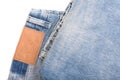 Jeans with leather label isolated on white Royalty Free Stock Photo