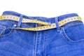 Jeans and measuring subject for weight loss on white background