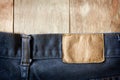 Jeans on old wooden surface background, empty space for texture Royalty Free Stock Photo