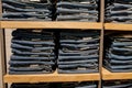 Jeans pants on the store shelf. Blue jeans denim Collection jeans stacked Royalty Free Stock Photo