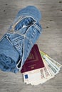 Jeans, passport and much money Royalty Free Stock Photo