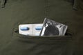 Jeans with pills and condom in pocket, closeup. Potency problem Royalty Free Stock Photo