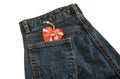 Jeans with red Christmas heart in pocket. Isolated over white. Royalty Free Stock Photo