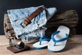 Jeans and rubber slippers Royalty Free Stock Photo