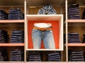 Jeans shop scene with shelves and mannequin