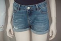 Jeans short on mannequin in fashion store for women