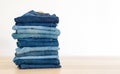 Jeans trousers stack on white background Royalty Free Stock Photo