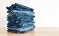 Jeans trousers stack on white background Royalty Free Stock Photo