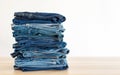 Jeans trousers stack on white background Royalty Free Stock Photo
