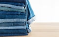 Jeans trousers stack on white background Royalty Free Stock Photo