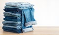 Jeans trousers stack on white background Royalty Free Stock Photo