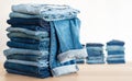 Jeans trousers stack on white background Royalty Free Stock Photo