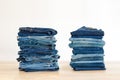 Jeans trousers stack on white background Royalty Free Stock Photo
