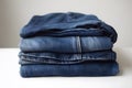 Jeans trousers stack on white background. Neural network AI generated Royalty Free Stock Photo