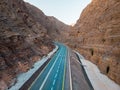 Jebel Jais mountain desert road surrounded by sandstones in Ras al Khaimah aerial view