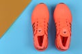 Jeddah Saudi Arabia July 22 2020 Pair of sport shoes on colorful background.  copy space. Overhead shot of running shoes. Top view Royalty Free Stock Photo