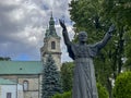 JEDRZEJOW, POLAND - September 1, 2023: Statue of Saint Pope John Paul II in front of the Cistercian Archabbey in Jedrzejow, Poland