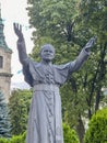 JEDRZEJOW, POLAND - September 1, 2023: Statue of Saint Pope John Paul II in front of the Cistercian Archabbey in Jedrzejow, Poland Royalty Free Stock Photo