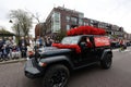 Jeep adorned with colorful floral arrangements at the Flower Parade Bollenstreek