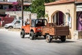 Jeep car with small cargo trailer at street of Paleochora town