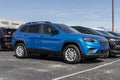 Jeep Cherokee display at a dealership. Jeep offers the Cherokee in Latitude LUX, Trailhawk, and Limited models