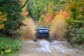 Jeep Cherokee TrailHawk 4x4 going offroad through waterhole