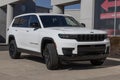 Jeep Grand Cherokee display at a dealership. Jeep offers the Grand Cherokee in Laredo, Limited, and Trailhawk models