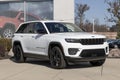 Jeep Grand Cherokee display at a dealership. Jeep offers the Grand Cherokee in Laredo, Limited, and Trailhawk models