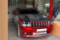 Kyiv, UA - September 4, 2012: Jeep Grand Cherokee SRT8 drives into the garage. Carbon hood