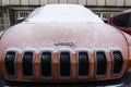 Jeep logo on Jeep Cherokee car in front of dealership building on January 20, 2017 in Prague, Czech republic