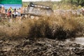 A vehicle`s racing in mud during an off-road racing competition. Royalty Free Stock Photo