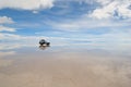 Jeep in the salt lake salar de uyuni Royalty Free Stock Photo