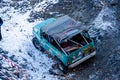 Khabarovsk, Russia - Nov 11, 2019: Jeep Suzuki Jimny overcomes obstacles in the forest