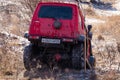 Khabarovsk, Russia - Nov 11, 2019: Jeep Suzuki Jimny overcomes obstacles in the forest