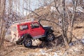 Khabarovsk, Russia - Nov 11, 2019: Jeep Suzuki Jimny overcomes obstacles in the forest