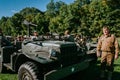 Jeep and troops in camp