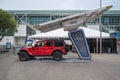 The jeep Wrangler and an Electrify America solar charger showcased at the LA Auto Show