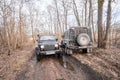 Jeep Wrangler and land Rover defender on a forest road Royalty Free Stock Photo