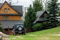 Jeep Wrangler Limited off-road car in front of cottage in mountains in High Tatras Royalty Free Stock Photo