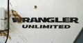 Jeep Wrangler Unlimited logo with dirt splash