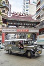 jeepney bus local transport traffic in downtown manila city street philippines