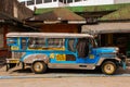 Jeepney parking on street in Manila, Philippines.