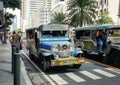 Jeepney run on Ayala road in Manila, Philippines Royalty Free Stock Photo